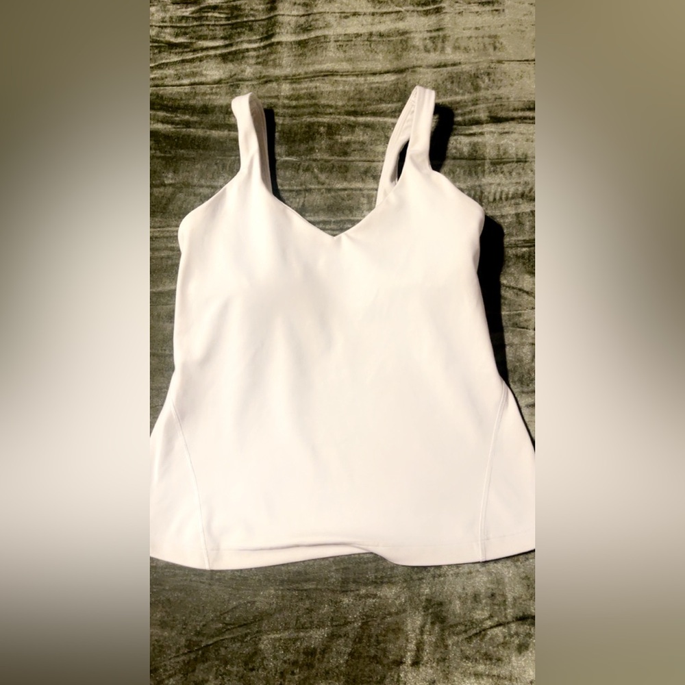 Lululemon light cream color soft Tank Top Sz 4 in good condition.